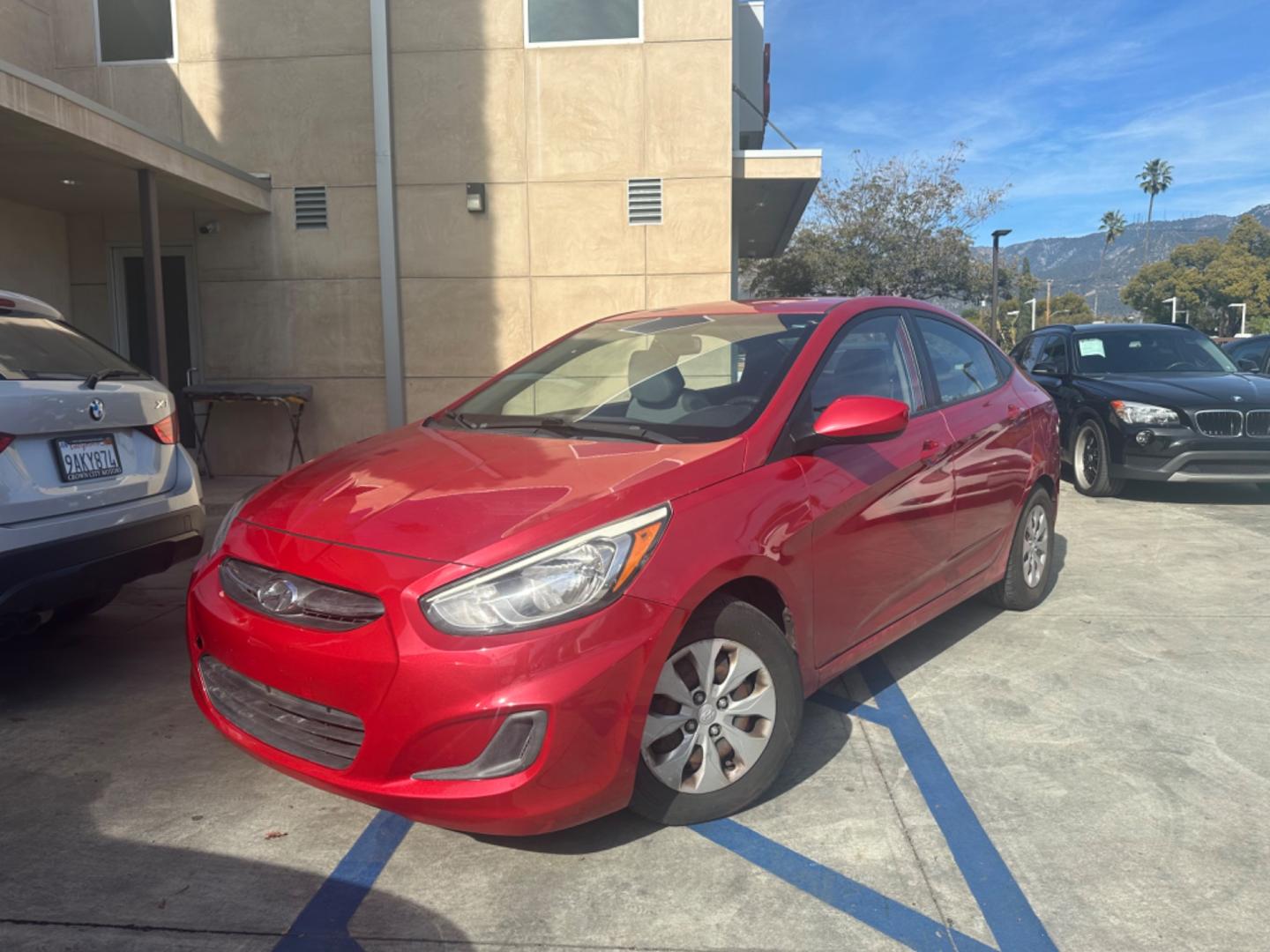 2015 Red /Gray Hyundai Accent GLS Sedan 4D (KMHCT4AE2FU) with an 4-Cyl, 1.6L engine, Auto, 6-Spd w/Overdrive transmission, located at 30 S. Berkeley Avenue, Pasadena, CA, 91107, (626) 248-7567, 34.145447, -118.109398 - The 2015 Hyundai Accent 4-Door Sedan stands as a testament to Hyundai's commitment to quality, efficiency, and value. Located in Pasadena, CA, our dealership specializes in providing a wide range of used BHPH (Buy Here Pay Here) cars, trucks, SUVs, and vans, including the remarkable Hyundai Accent. - Photo#0